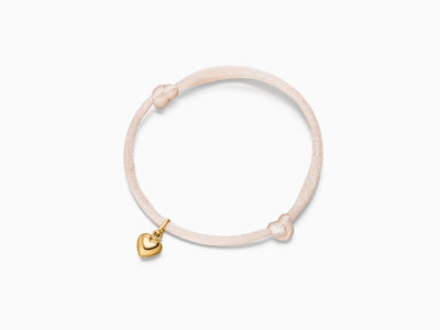 Heart pendant on silk bracelet
